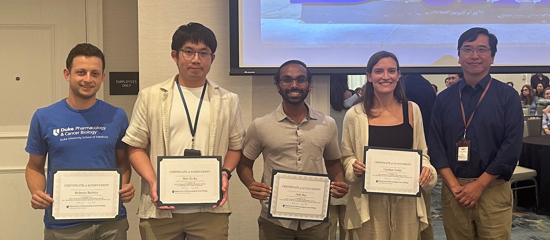 Dr. Lee Zou, left, stands with 2024 Fitzgerald Academic Achievement Award Winners.